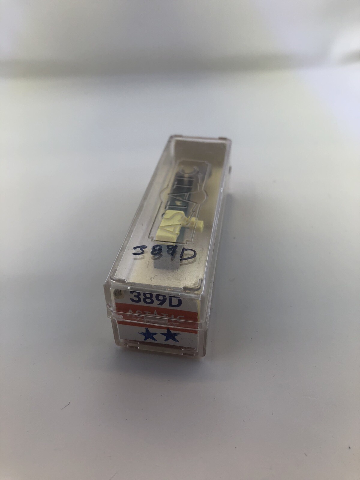 Astatic 389D Phonograph cartridge with headshell and needle.